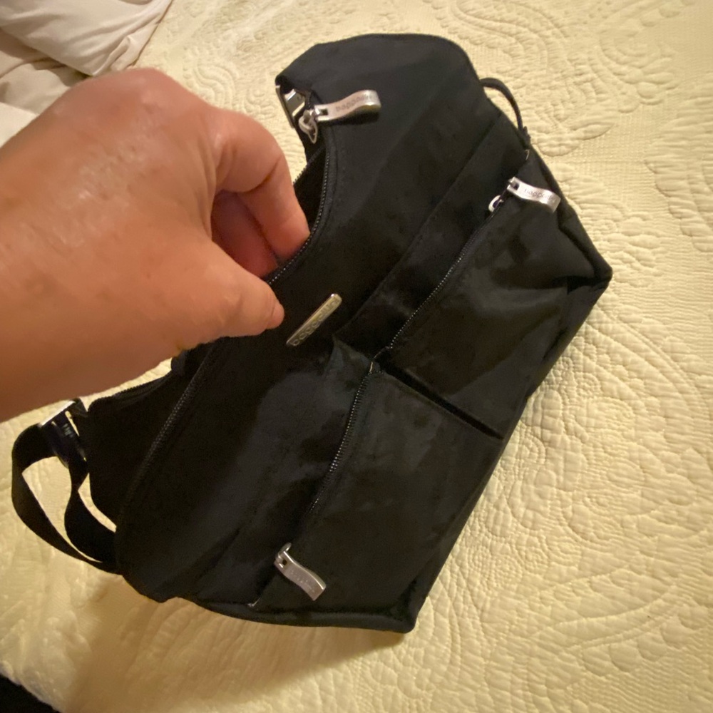 Black cross over bag with xtra attached small bag for ??